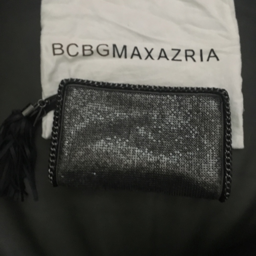 NWOT BCBG clutch. Excellent condition. 9”x6”x1”